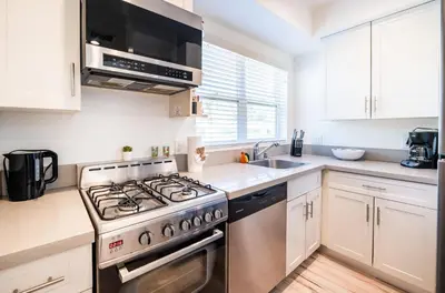 a kitchen with a stove and a sink at New York loft- style 3 levels 2 Bath by Hollywood in Los Angeles