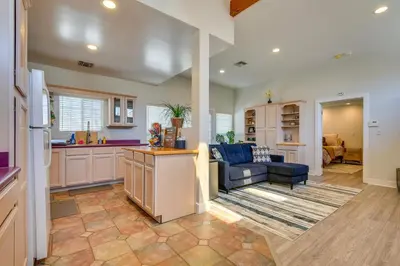 a kitchen and living room with a couch and a table at Luxe Pasadena Casita with Fireplace and Grill in Pasadena