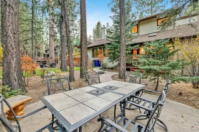 a picnic table and chairs in front of a house at The Spa at Winterset- Incredible Resort Estate Chalet- Indoor Hot Tub- Games in Big Bear Lake