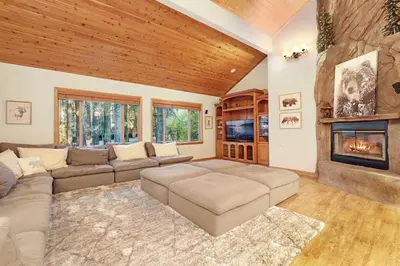 a living room with a couch and a fireplace at The Spa at Winterset- Incredible Resort Estate Chalet- Indoor Hot Tub- Games in Big Bear Lake