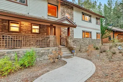 a brick house with a sidewalk in front of it at The Spa at Winterset- Incredible Resort Estate Chalet- Indoor Hot Tub- Games in Big Bear Lake