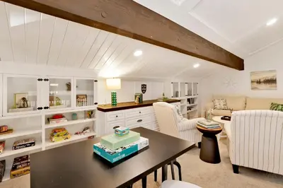 a kitchen and living room with a table and chairs at Soaring Pines by Big Bear Vacations Central Cozy Estate Chalet in Big Bear Lake