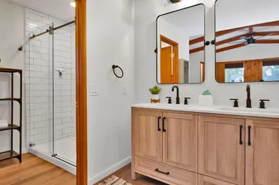 a bathroom with a sink and a shower at The Lost Compass- Hot Tub- Games- Walk To Lake or Marina in Big Bear Lake