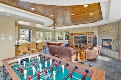 a living room with a pool table and a fireplace at Sunset Ridge Villa- Incredible Log Cabin Estate- Hot Tub- Game Tables- in Big Bear Lake