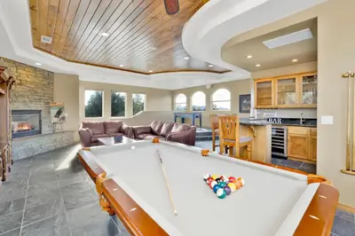 a living room with a pool table in it at Sunset Ridge Villa- Incredible Log Cabin Estate- Hot Tub- Game Tables- in Big Bear Lake