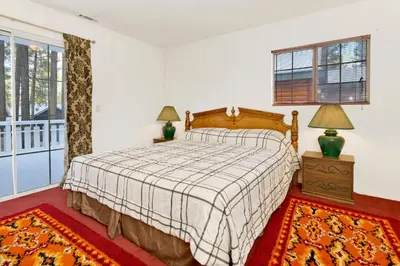 a bedroom with a bed and a window at Cozy Summit- Cozy Central Resort Chalet- Minutes to Activities in Big Bear Lake
