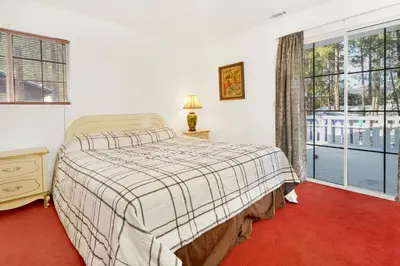 a bedroom with a bed and a large window at Cozy Summit- Cozy Central Resort Chalet- Minutes to Activities in Big Bear Lake