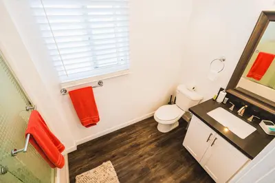 a bathroom with a toilet and a sink and a mirror at Nice and Close to Downtown 1 Bedroom Sleeps 4 in Los Angeles