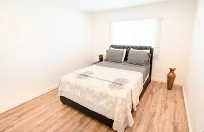 a bedroom with a bed and a window at Modern Furnished 1-Bedroom with Free Parking in Koreatown close to DT LA in Los Angeles