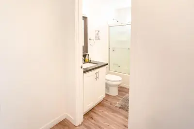 a bathroom with a toilet and a sink at Modern Furnished 1-Bedroom with Free Parking in Koreatown close to DT LA in Los Angeles