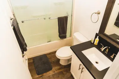 a bathroom with a toilet and a sink and a shower at Cozy Koreatown 1 Bedroom Modern Furnished Free Parking in Los Angeles