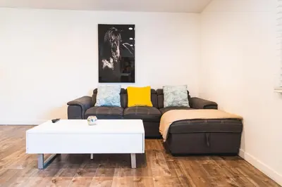 a living room with a couch and a coffee table at Cozy Koreatown 1 Bedroom Modern Furnished Free Parking in Los Angeles
