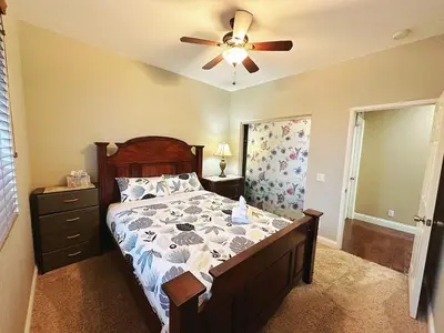a bedroom with a bed and a ceiling fan at Cozy And Comfortable #202 Room in Corona