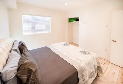 a bedroom with a couch with a blanket on it at Hollywood 3Bedrooms Stylish Loft with 2 Parking in Los Angeles