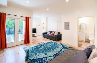 a living room with a bed and a couch at Hollywood 3Bedrooms Stylish Loft with 2 Parking in Los Angeles