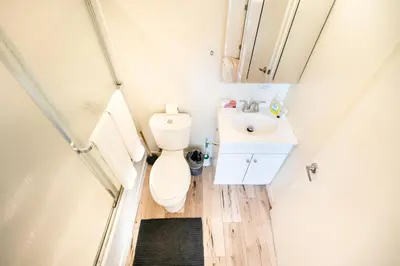 a small bathroom with a toilet and a sink at Hollywood 3Bedrooms Stylish Loft with 2 Parking in Los Angeles