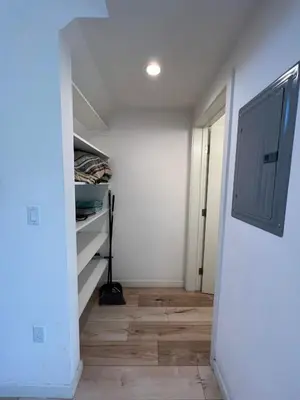 an attic room with a staircase and a room with a closet at Modern One-Bed Loft in Hollywood Sign View & Free Parking in Los Angeles