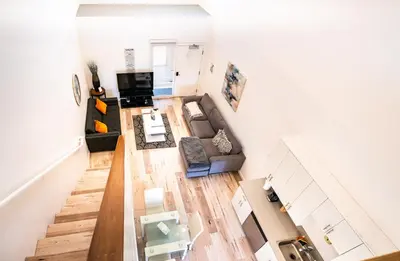an overhead view of a living room with a couch at Chic 1-Bed Hollywood Loft Iconic Sign Views & Private Parking in Los Angeles