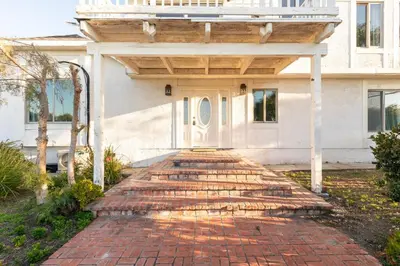 a brick walkway in front of a house at 30 PCT OFF! Malibu Romantic Suite, Ocean View, Beach in Malibu