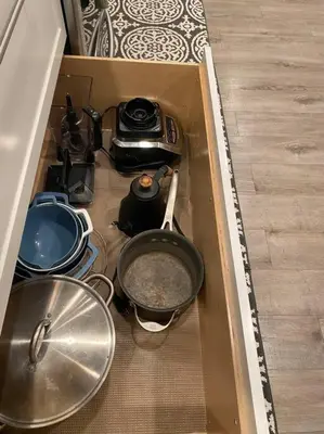 a drawer full of pots and pans in a kitchen at Private Heated Pool Oasis/Disney/Retro Arcade/Gym in Placentia
