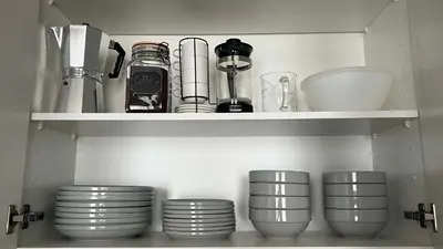 a cupboard with plates and other kitchen utensils at Downtown LA's Most Requested Property, Sleeps 4 with Free Parking! in Los Angeles