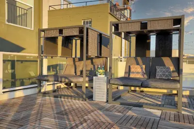 a deck with two chairs on a balcony at Downtown LA's Most Requested Property, Sleeps 4 with Free Parking! in Los Angeles