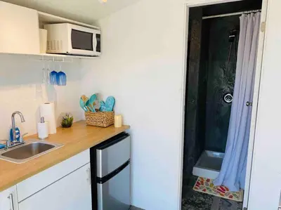 a small kitchen with a sink and a microwave at 30 PCT OFF! Malibu Serene Cabin, Ocean View, Beach in Malibu