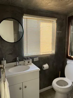 a bathroom with a sink and a toilet and a mirror at 30 PCT OFF! Malibu Serene Cabin, Ocean View, Beach in Malibu