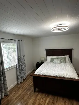 a bedroom with a large bed and a window at Buxton Private Room and Bath Wheel Chair Access in Rialto