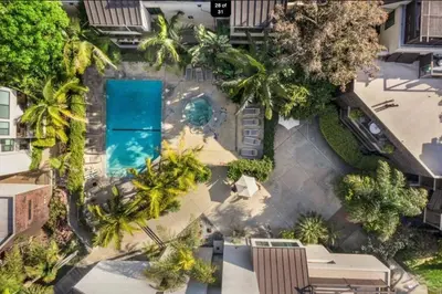 an overhead view of a pool with palm trees at Updated Gorgeous studio condo in West Hollywood with Pool in Los Angeles