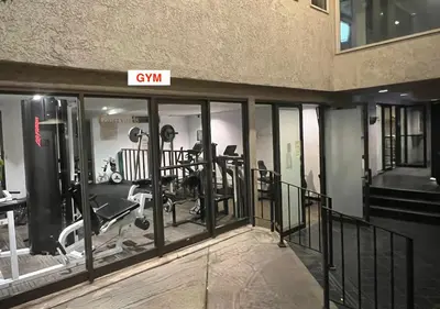 a gym in a building with glass doors at Updated Gorgeous studio condo in West Hollywood with Pool in Los Angeles