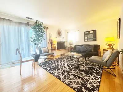 a living room with a couch and a table at Charming 3BR House - Hal-UC in Los Angeles