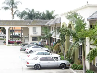 a group of cars parked in front of a building at National Inn Garden Grove in Anaheim