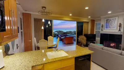 a kitchen with a sink and a living room at 3 Bedroom 2 Bath Beachfront Home in Huntington Beach