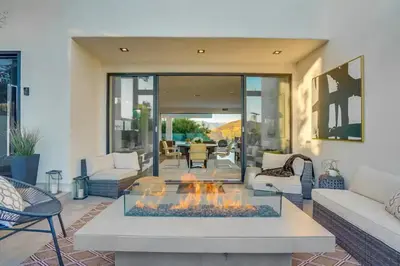 a living room with a fire pit in the middle at Troy Hill in Los Angeles