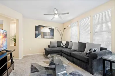 a living room with a couch and a tv at Lovely & coxy 2BR/2BA! 5MIN to Disney! in Anaheim