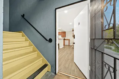 a staircase leading to a home with a glass door at Cozy & Serene ~ 12mins to Downtown LA in Alhambra