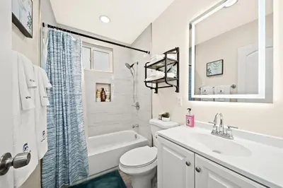 a white bathroom with a sink and a toilet at Cozy & Serene ~ 12mins to Downtown LA in Alhambra