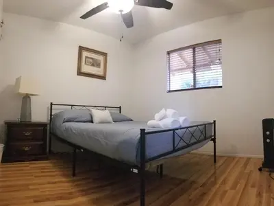 a bedroom with a bed and a ceiling fan at Lake Isabella View, Wofford Heights, Kern County in Wofford Heights