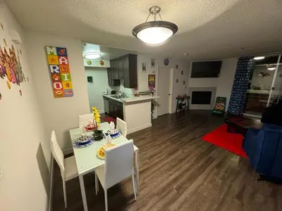 a kitchen and living room with a table and chairs at Mario, Disney & not themed Loft Universal Studios 10min loft apartment in Los Angeles