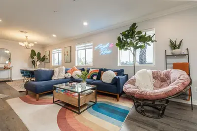 a living room with blue couches and a table at Angel & Rose * Hollywood DTLA in Los Angeles