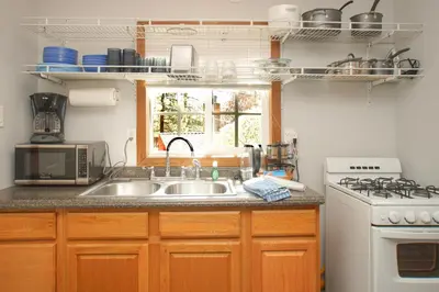 a kitchen with a sink and a stove at Baby Bear - A delightful studio style property in the perfect central location! in Big Bear Lake