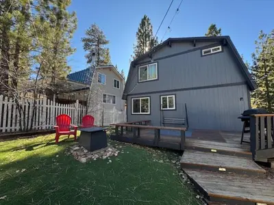 a tiny house with a picnic table and a bench at Bear PAC Hideout - Walk to Alpine Slide and only minuetes to The Village! Billiards and foosball! in Big Bear Lake