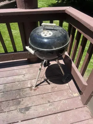a bbq grill sitting on a wooden bench at Brown Bear's Den - Spacious condo within walking distance to all Big Bear has to offer! in Big Bear Lake