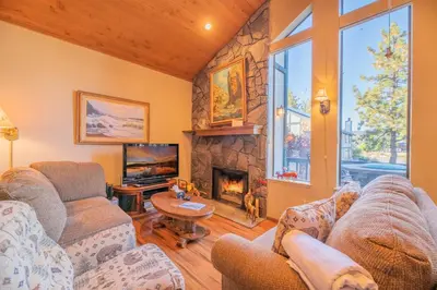 a living room with couches and a fireplace at Lakefront Viking Oasis - Beautiful Viking Estates condo complex on the lake! in Big Bear Lake