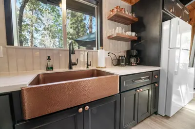 a kitchen with a sink and a window at The Oasis Chalet - Walking distance to The Village, The Lake, and Alpine Slide! in Big Bear Lake
