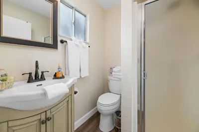 a bathroom with a sink and a toilet at The Bear Den - DREAM LOCATION WALKING DISTANCE TO LAKE AND VILLAGE! in Big Bear Lake