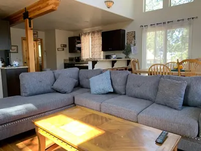 a living room with a couch and a coffee table at The Fox Paw - Cozy and spacious cabin! Family game room with Foosball and Pool Table! Jet Tub! in Big Bear Lake
