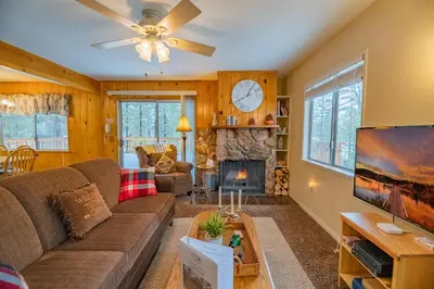 a living room with a couch and a fireplace at Sweet Retreat - Spectacular little hideaway, cozy family getaway near the lake! in Big Bear Lake