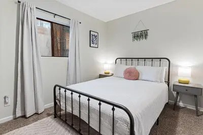 a bedroom with a bed and a window at Badger Den - Located in the heart of the village in Big Bear Lake